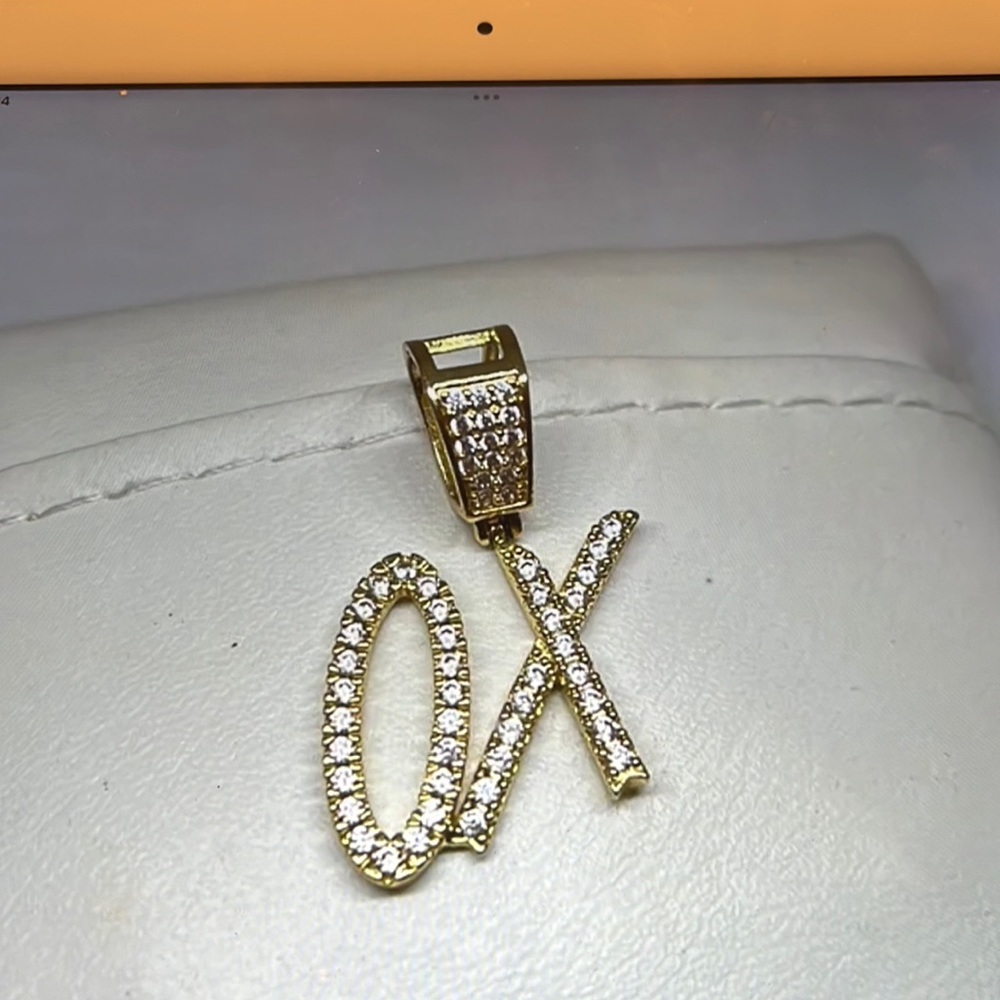 Ladies gold/ss XO pendant, 1 &1/4” in Length, beautiful worn only few times